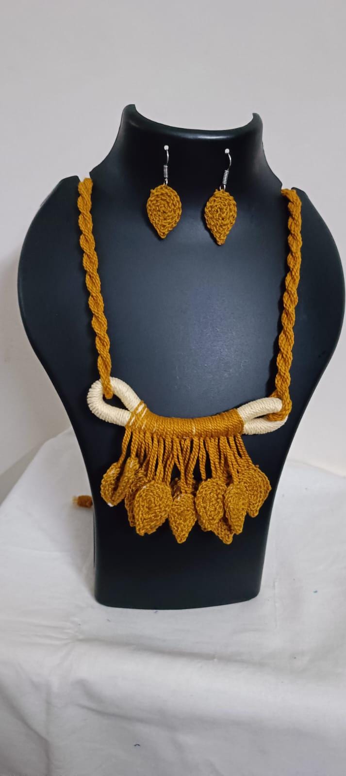 Golden brown Crochet thread necklace set with leaf fringes and matching earrings