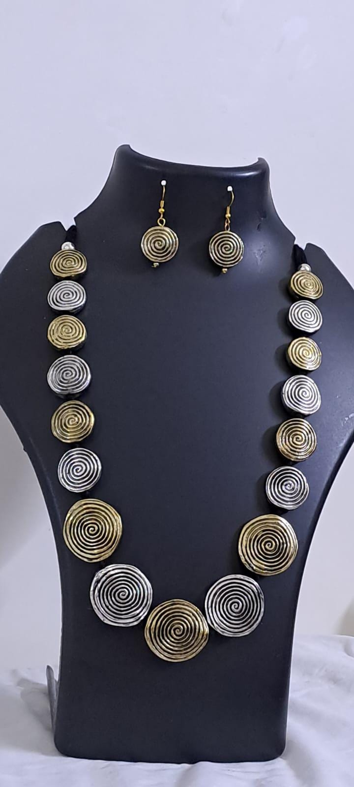 Exclusive silver oxidised set with flat round beads of gold n silver tone mix n matching earrings