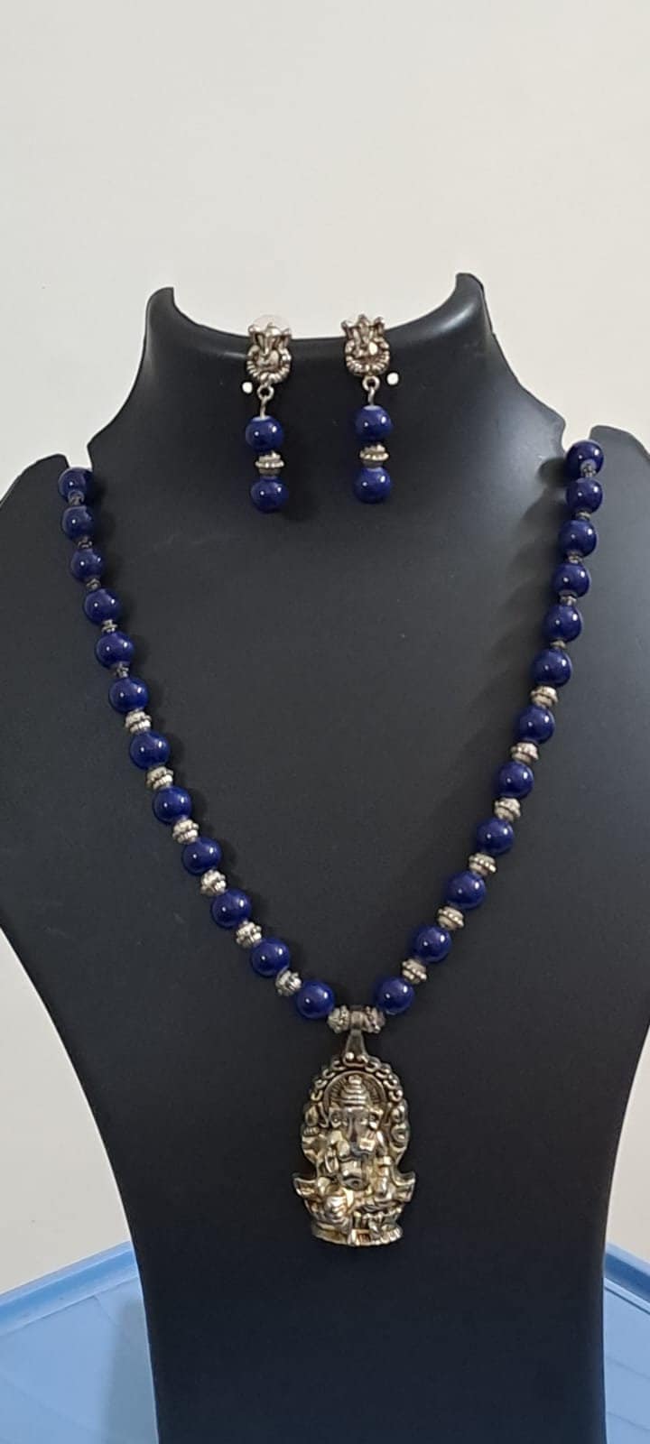 Blue glass beads necklace with oxidised silver ganesha pendant