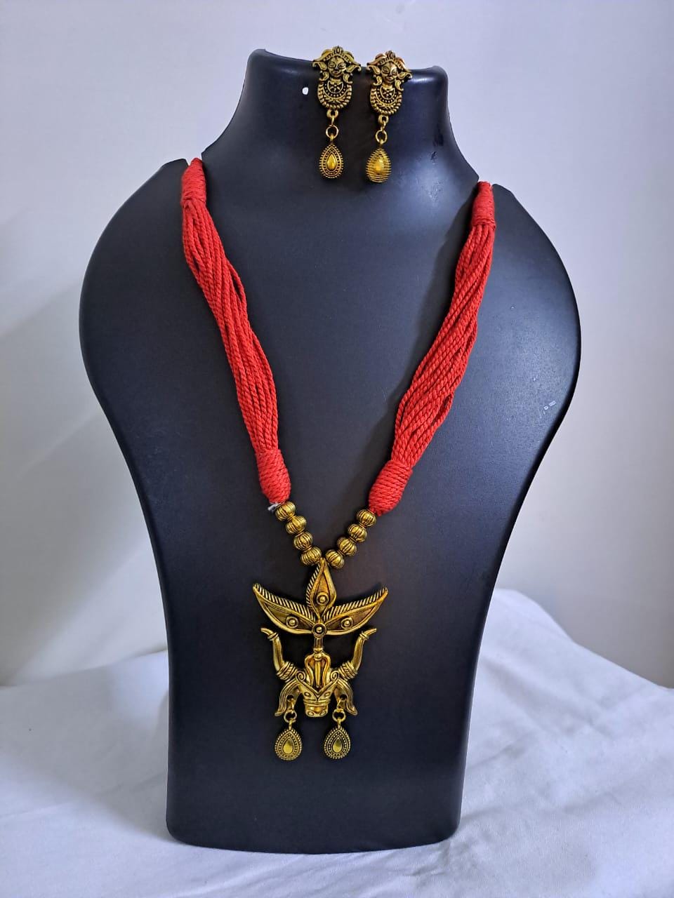 Red thread necklace with golden oxidised Durga pendant n matching earrings