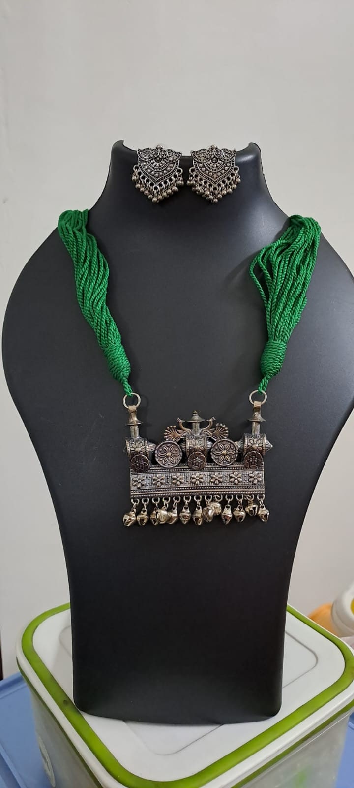 Green thread necklace with silver oxidised traditional pendant