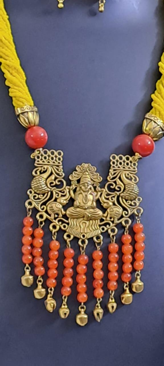 Exclusive multi layered  yellow glass seed beads necklace set with golden  oxidised pendant n earrings