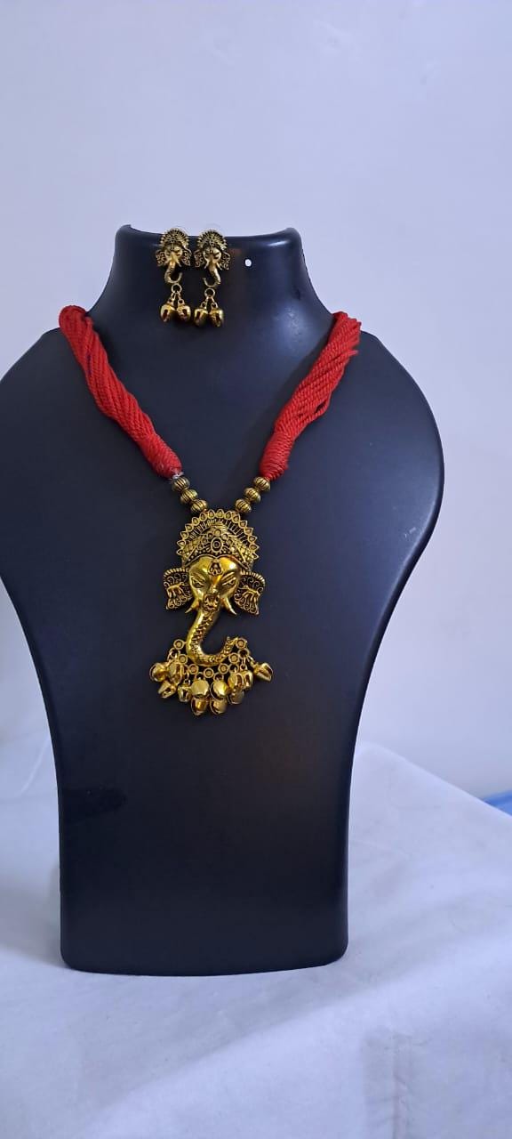 Red thread necklace with Golden oxidised traditional pendant