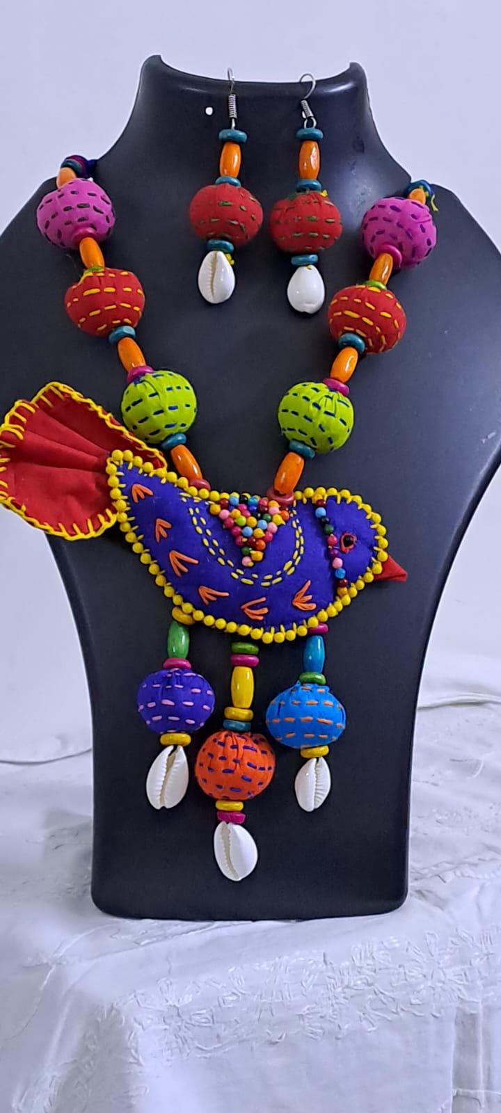 Exclusive fabric necklace with embroidered blue fabric bird pendant and fabric beads n matching beads