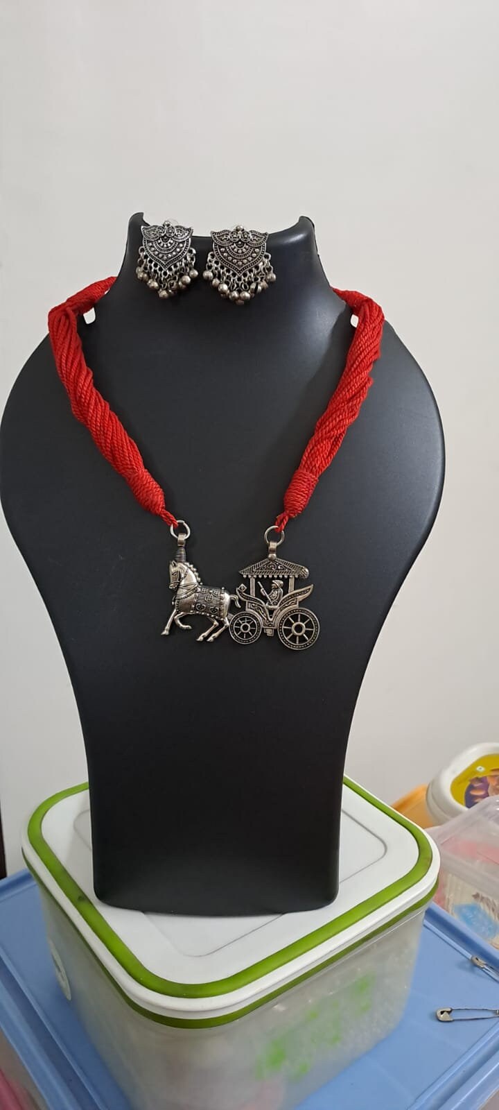 Red thread necklace with silver oxidised traditional pendant