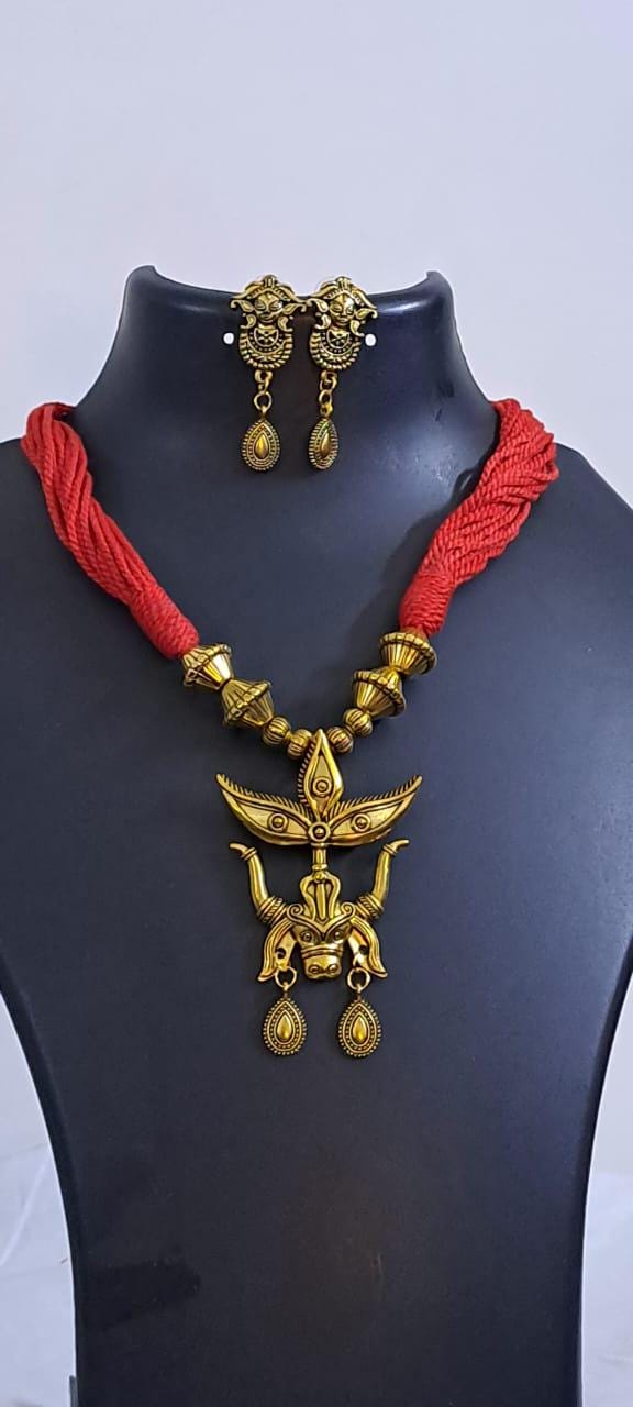 Red thread necklace with golden oxidised pendant
