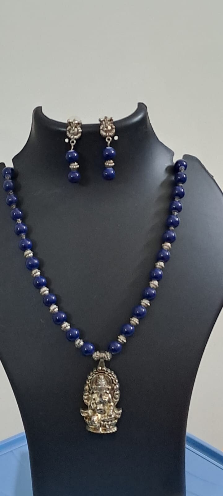 Blue glass beads necklace with oxidised silver ganesha pendant