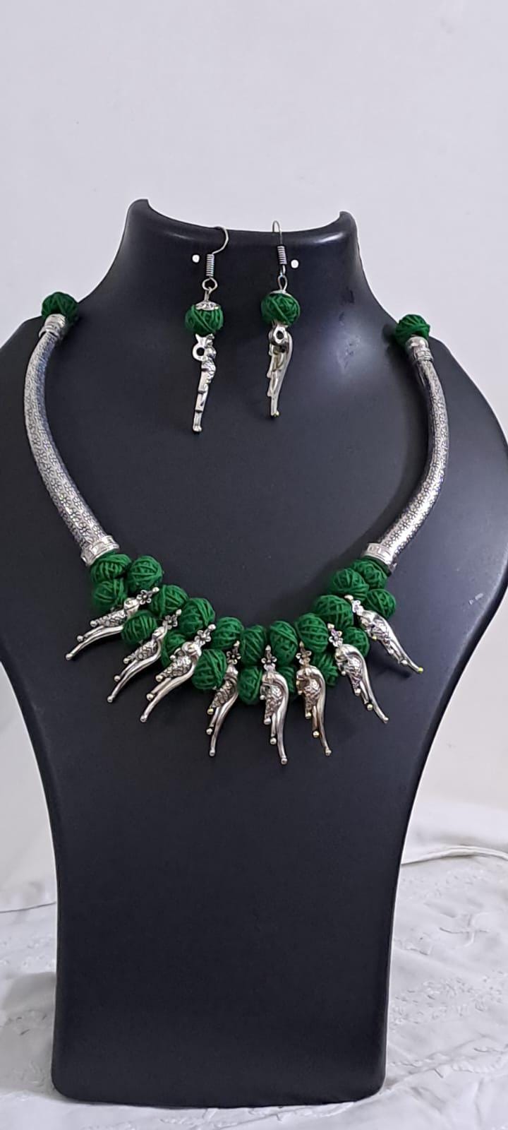 Green thread necklace with kolhapuri silver oxidised traditional beads and matching earrings