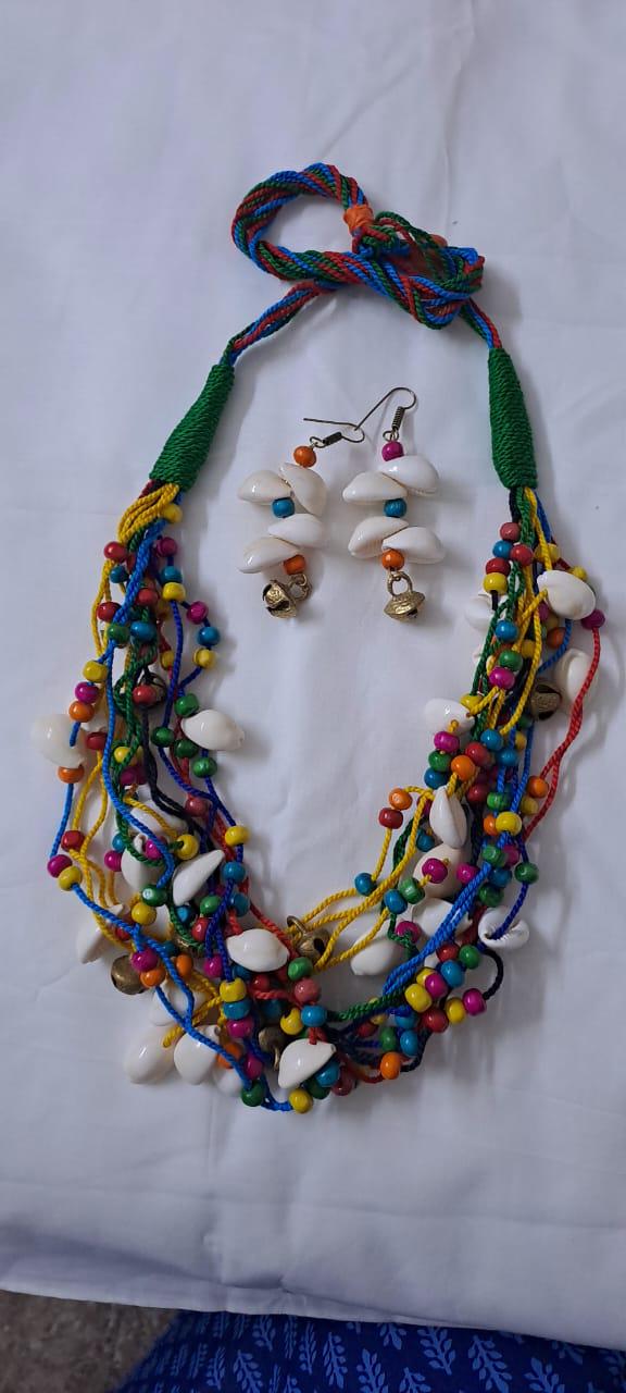 Exclusive multi-coloured and multi-layered thread necklace with shells, wooden beads n trinkets.
