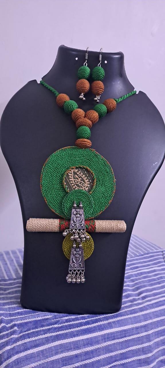 Exclusive green n brown thread beads necklace set with round thread n silver oxidised pendant n matching earrings