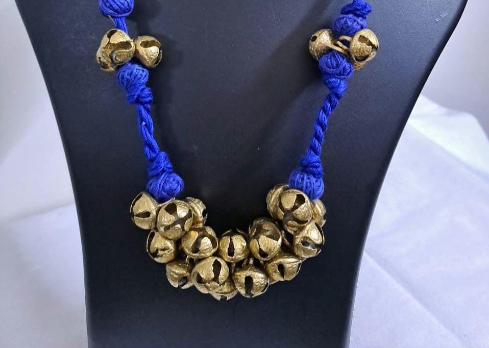 Blue thread necklace with trinkets n matching earrings