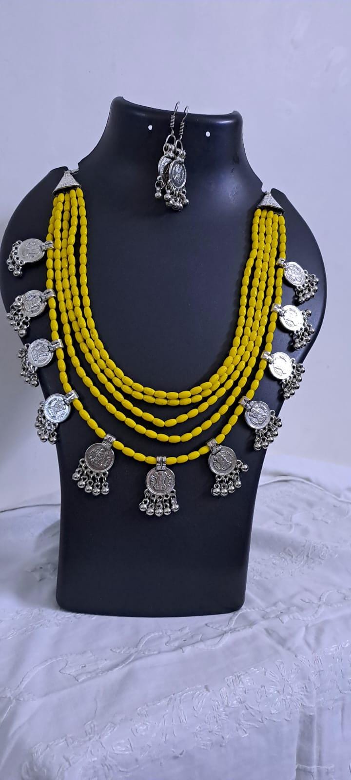 Exclusive multi layered  yellow glass beads necklace set with silver oxidised charms n matching earrings