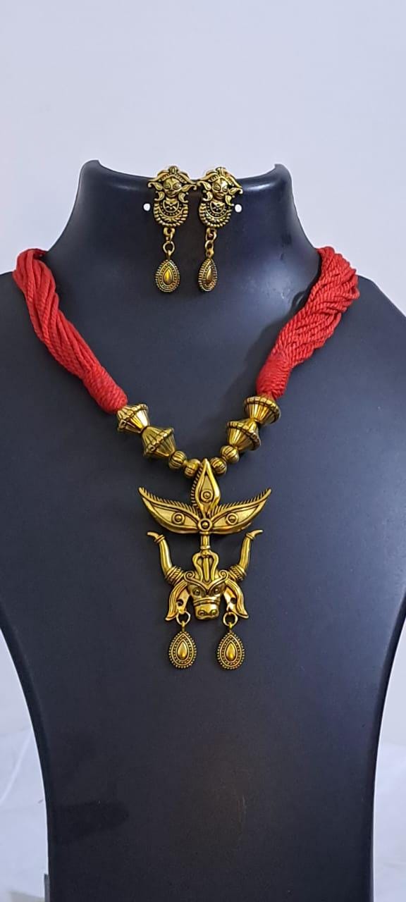 Red thread necklace with golden oxidised pendant