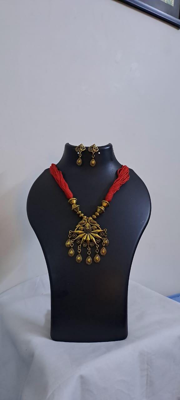 Red thread necklace with Golden oxidised traditional pendant