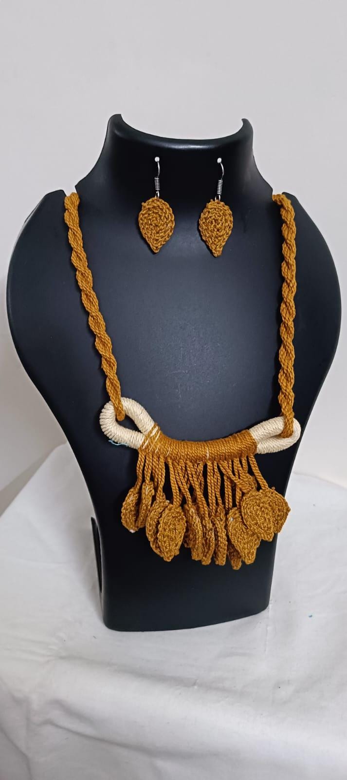 Golden brown Crochet thread necklace set with leaf fringes and matching earrings