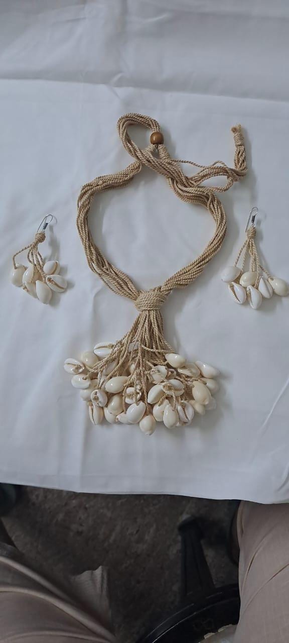 Multi layered jute necklace with shell fringes and with matching earrings.