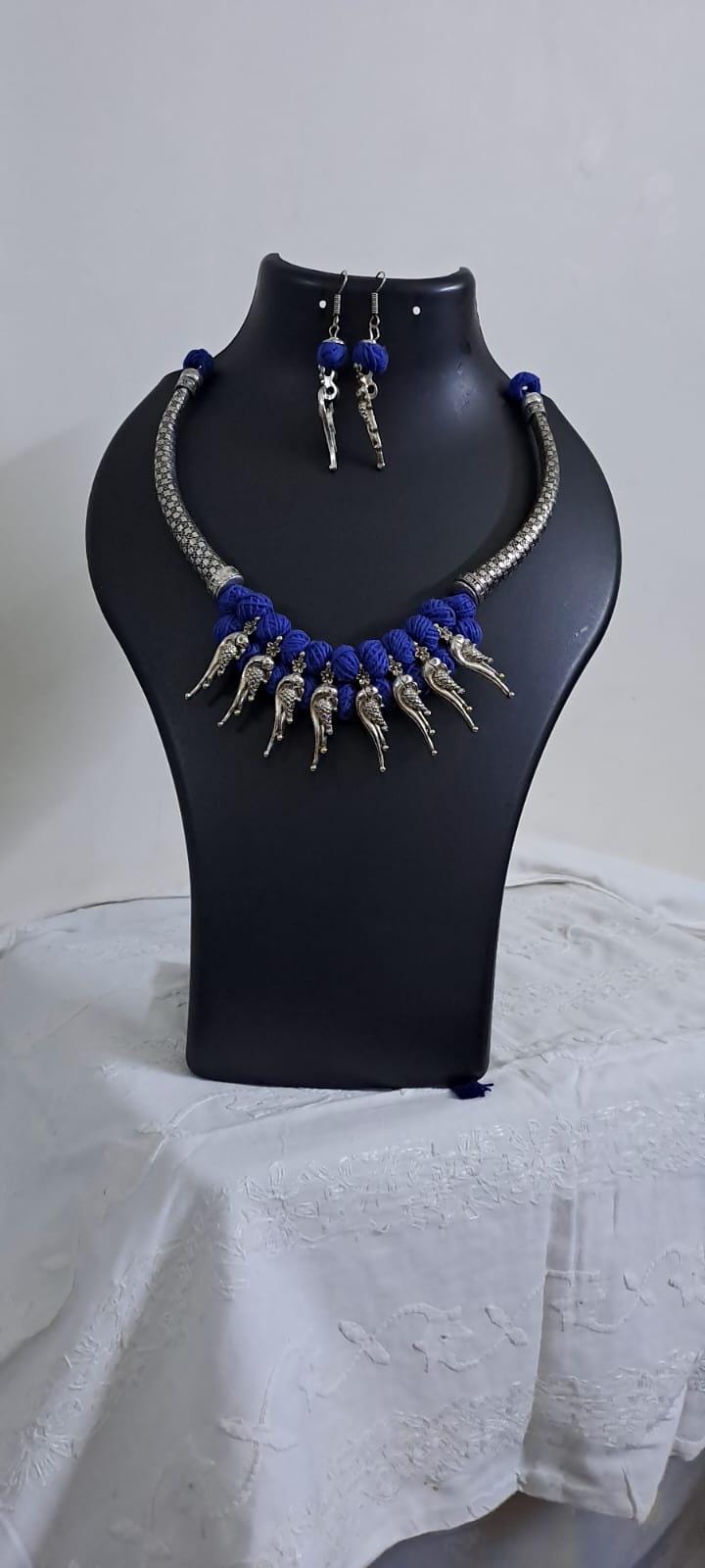Blue thread necklace with kolhapuri silver oxidised traditional beads and matching earrings