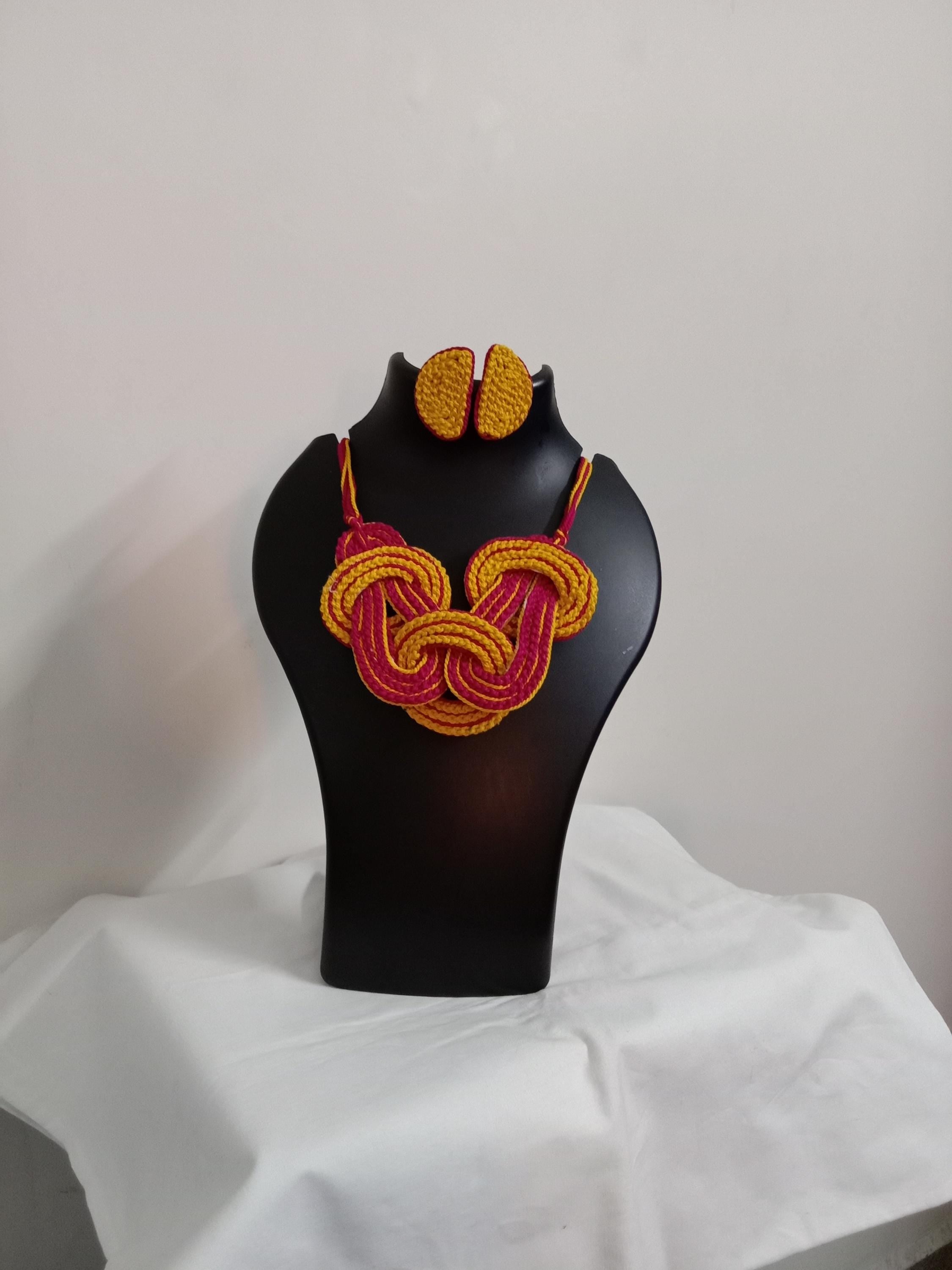 Celtic knot thread necklace with matching thread earrings.
