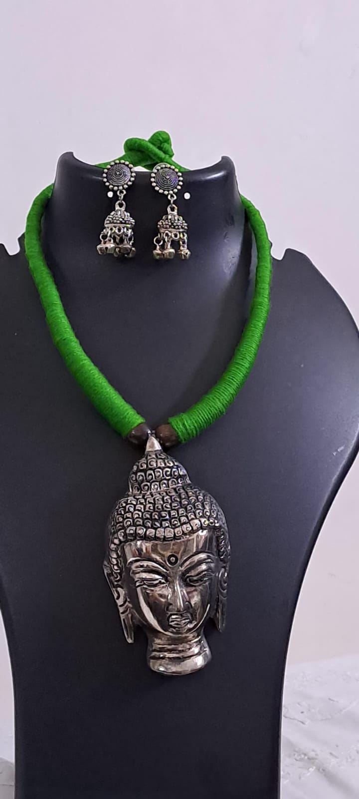 Green thread necklace with silver oxidised buddha pendant