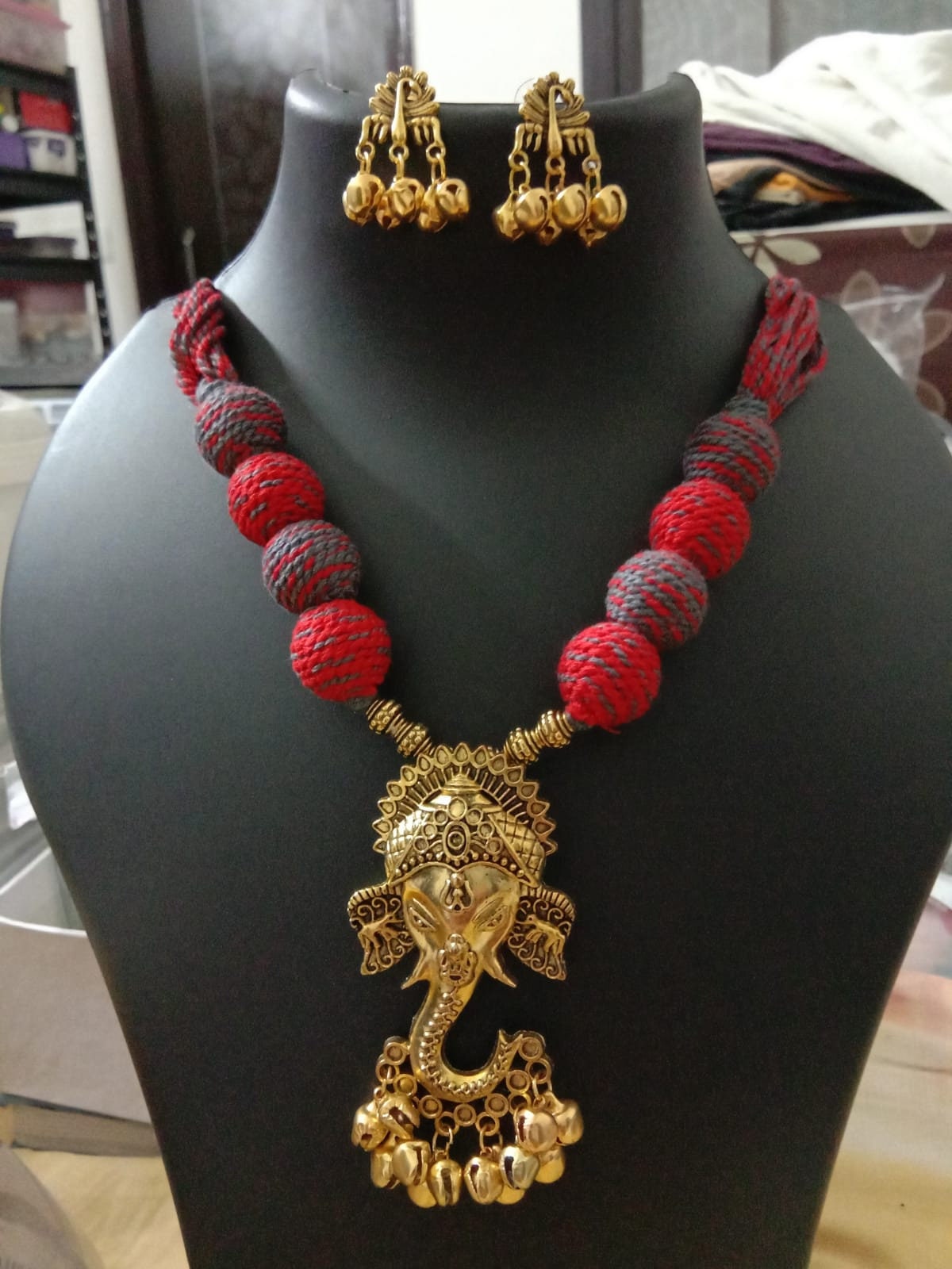 Oxidised golden ganesha traditional pendant and matching earrings.
