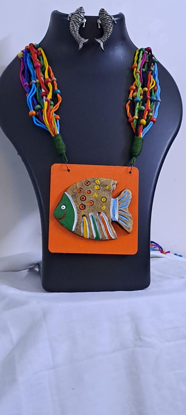 Terracotta fish pendant and thread necklace