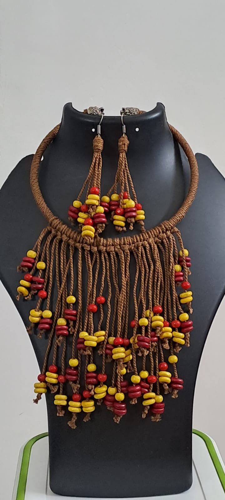 Exclusive brown thread neckband with fringes and matching earrings.