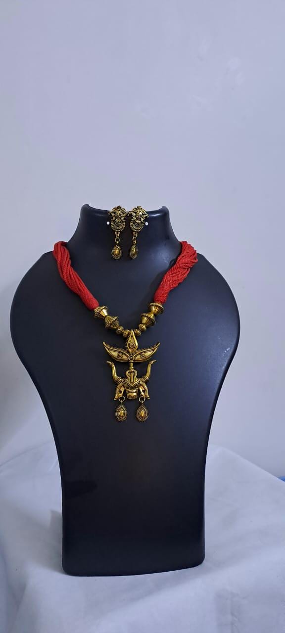 Red thread necklace with golden oxidised pendant