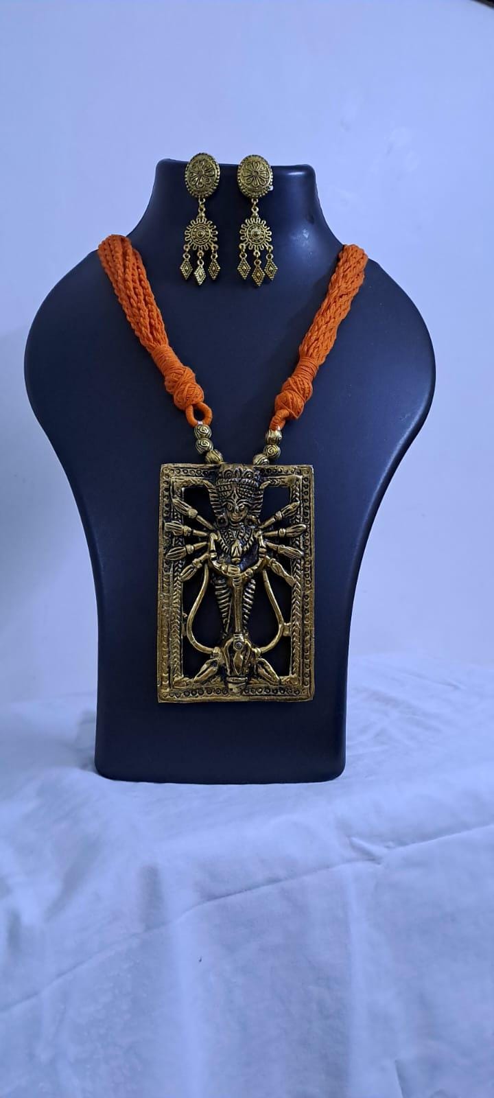Orange thread necklace with oxidised golden durga pendant