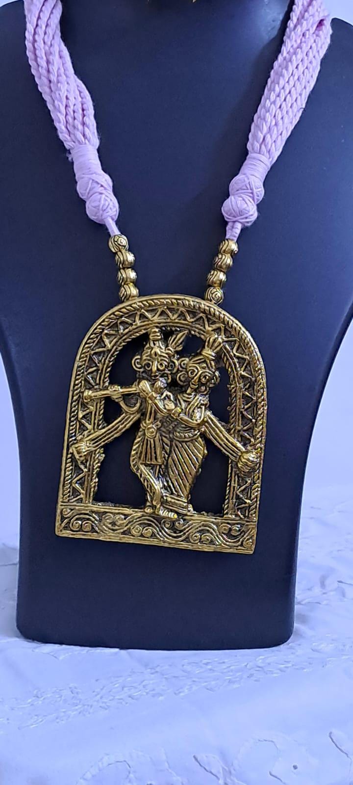 Radha Krishna golden oxidised pendant necklace in pink tread with matching earrings