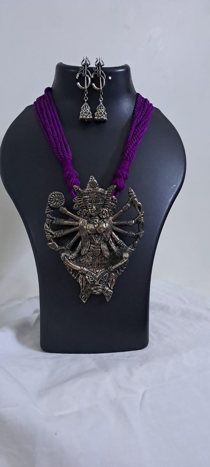 purple thread necklace with oxidised golden durga pendant