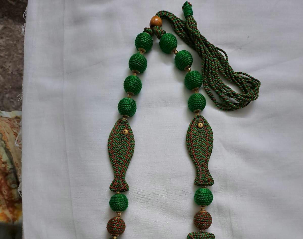 Exclusive brown n green thread necklace with fish shape thread beads and matching earrings.