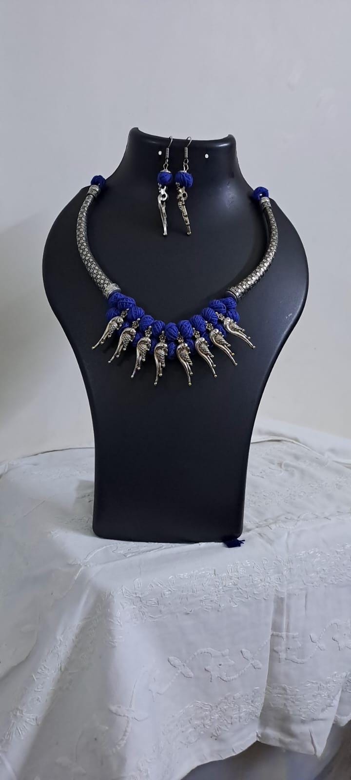 Blue thread necklace with kolhapuri silver oxidised traditional beads and matching earrings