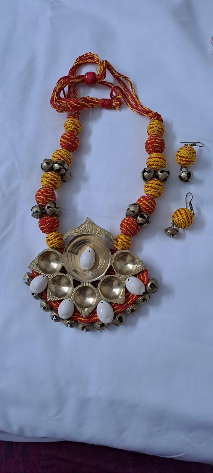 Red yellow thread beads necklace set with dokra pendant n matching earrings