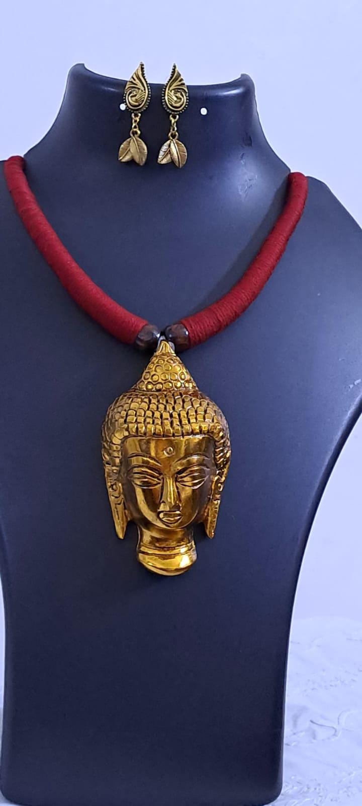 Maroon thread necklace with oxidised golden buddha pendant