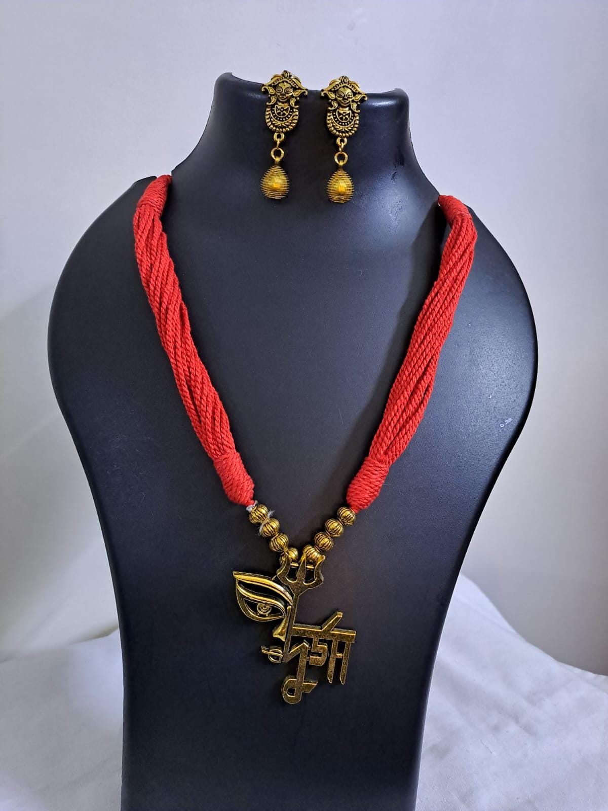 Red thread necklace set with golden oxidised Durga pendant n matching earrings