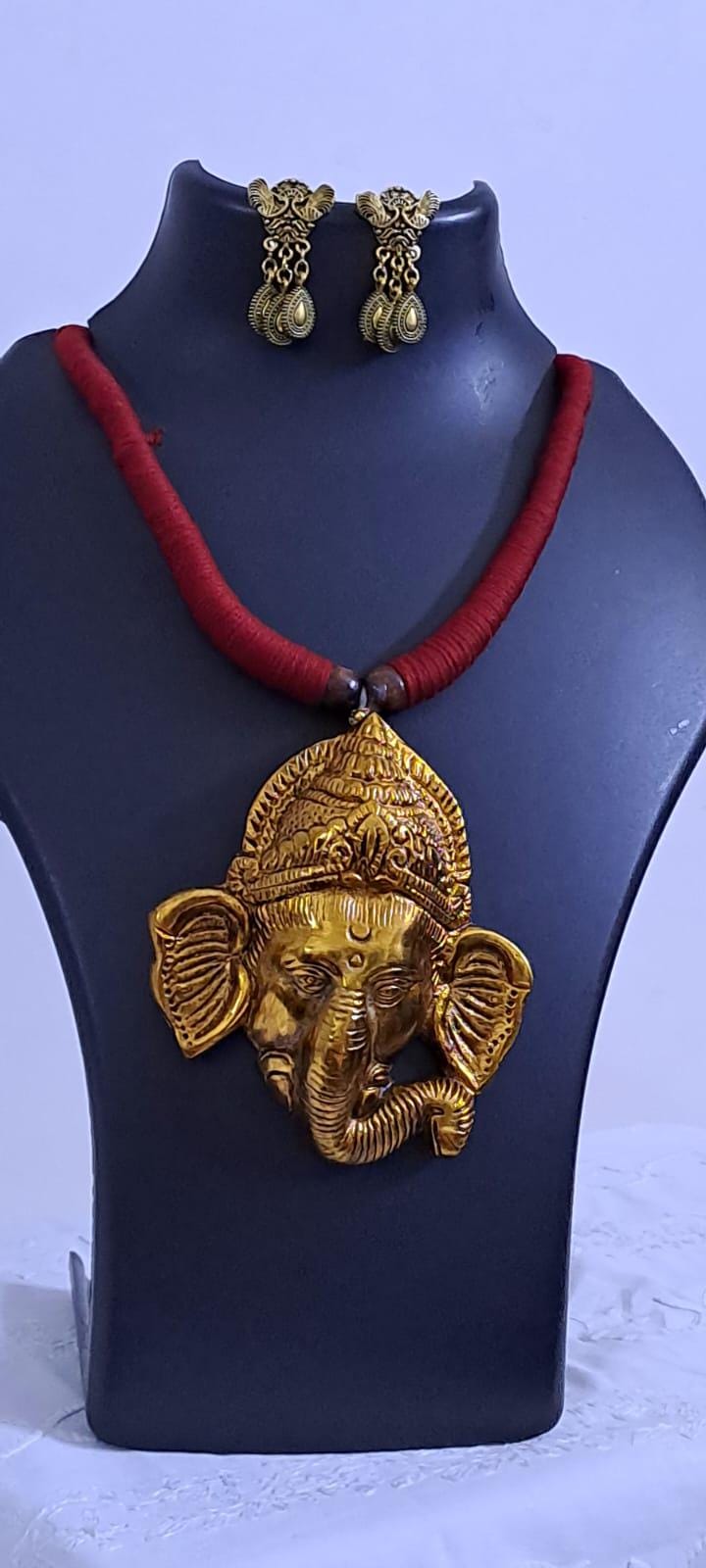 Maroon thread necklace with golden oxidised ganesha pendant
