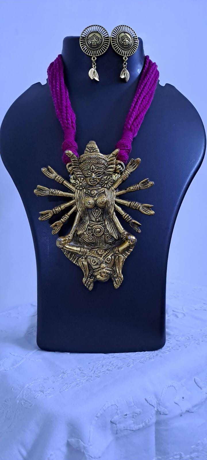 Pink thread necklace with oxidised golden durga pendant