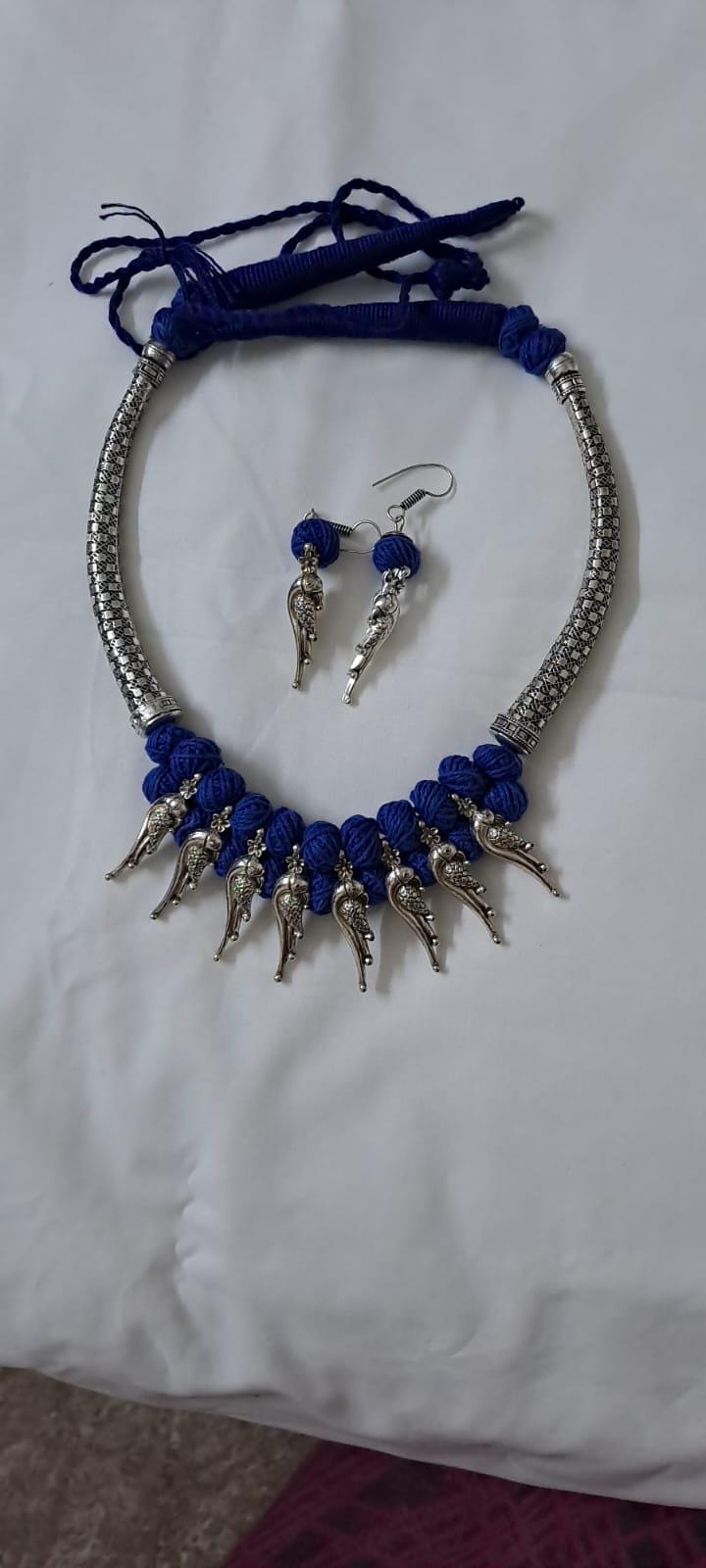 Blue thread necklace with kolhapuri silver oxidised traditional beads and matching earrings