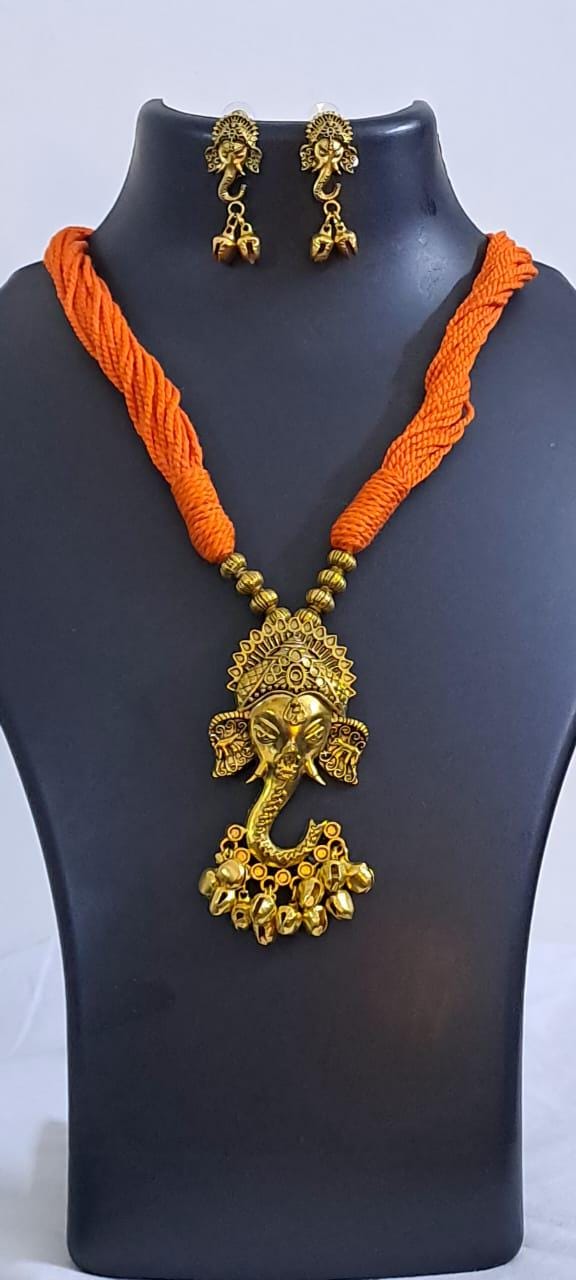 Orange thread necklace with Golden oxidised traditional pendant