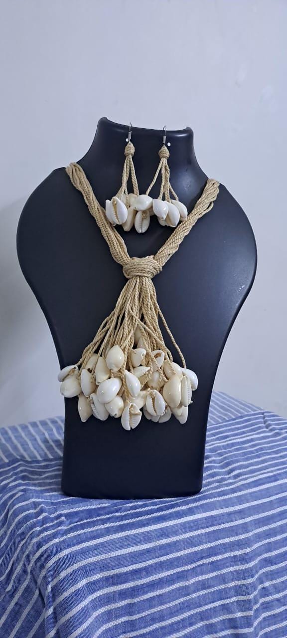 Multi layered jute necklace with shell fringes and with matching earrings.