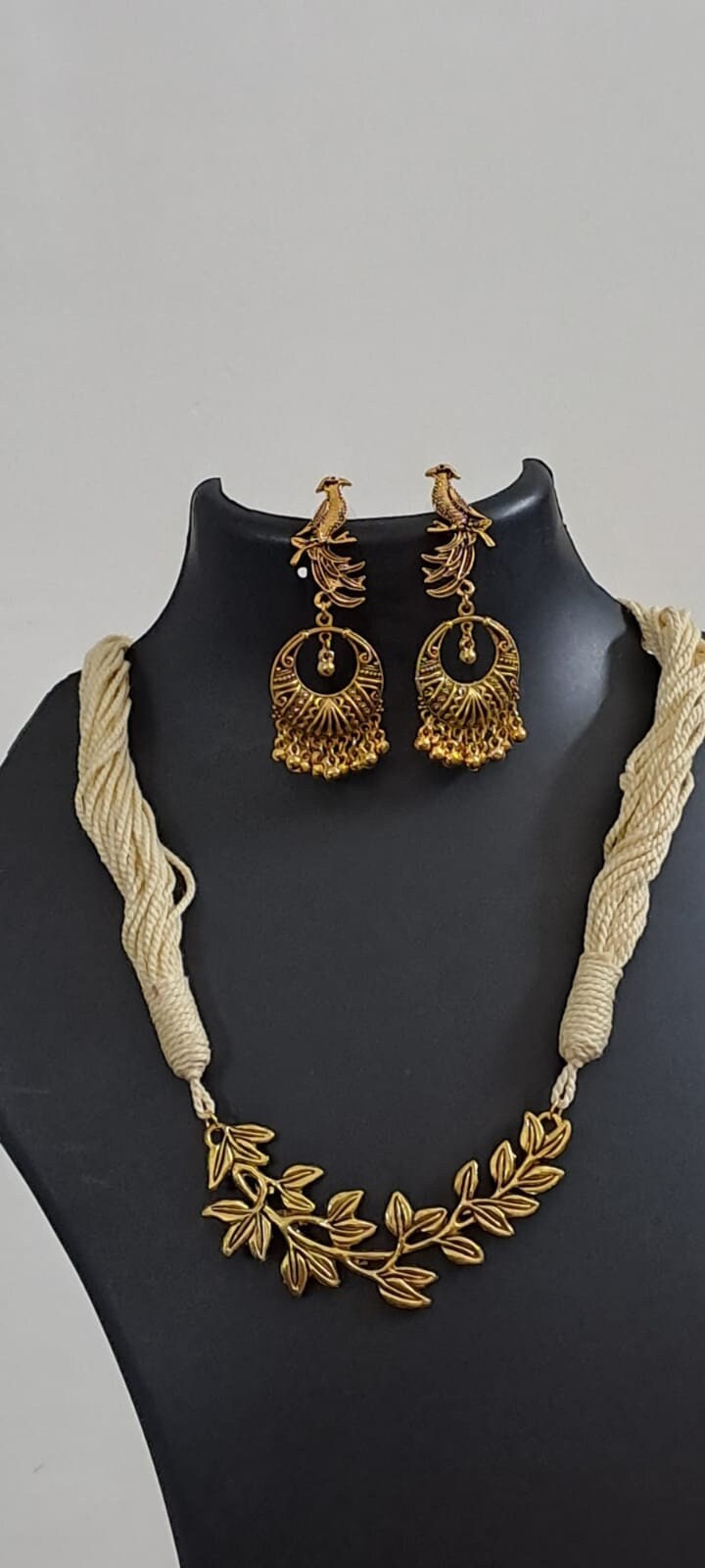 Off white thread necklace with Golden oxidised traditional pendant