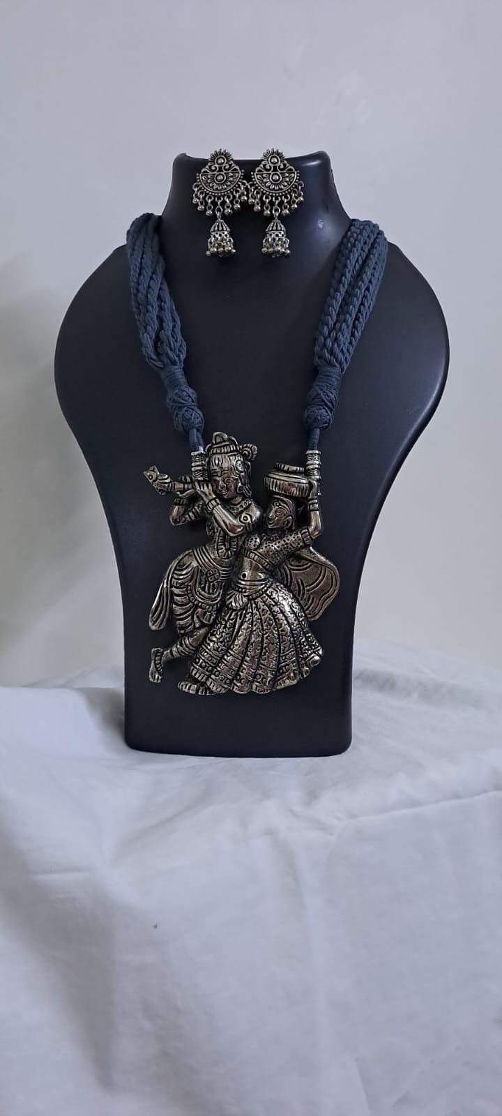 Radha Krishna silver oxidised pendant necklace in grey thread with matching earrings