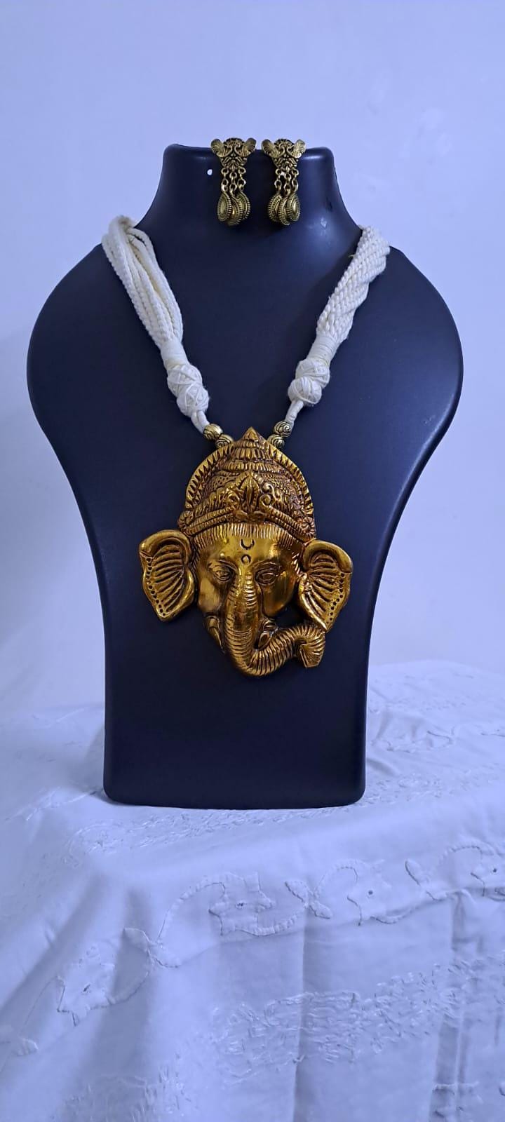 Off-white thread necklace with golden oxidised ganesha pendant
