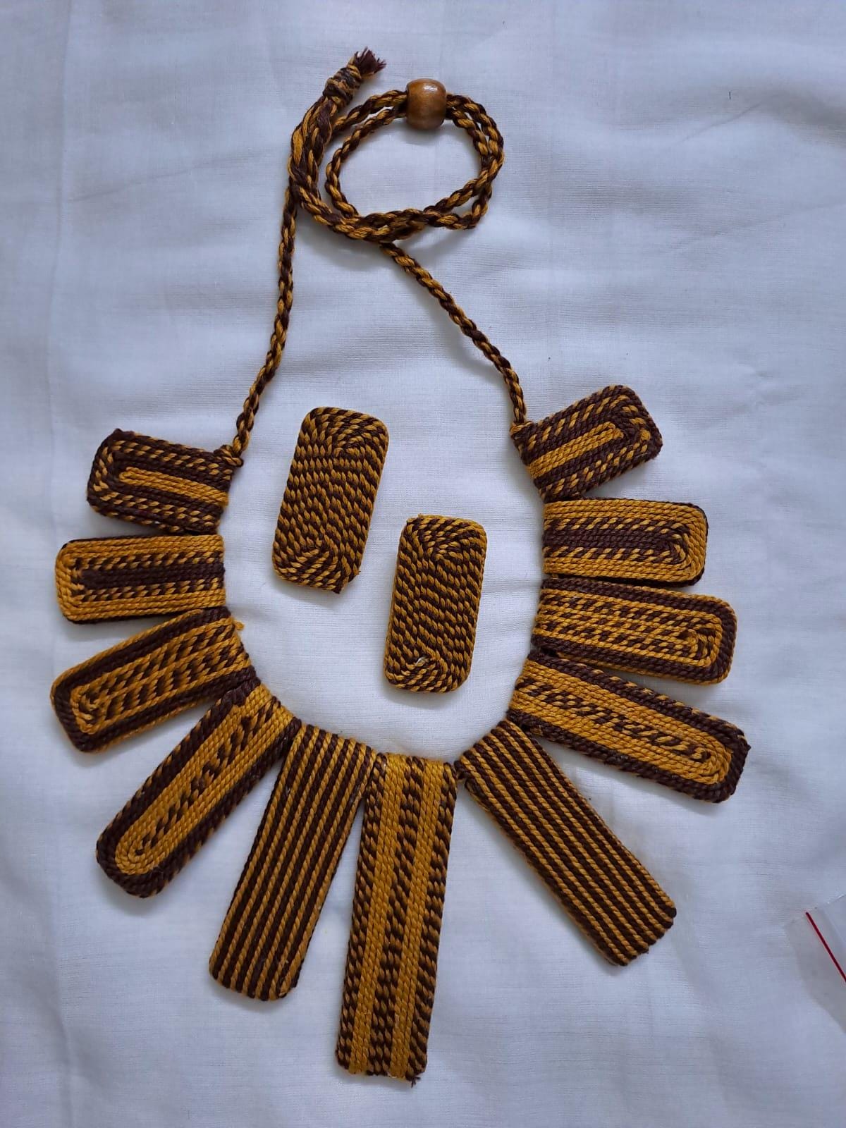 Exclusive brown n yellow thread necklace with rectangle shape thread beads and matching earrings.