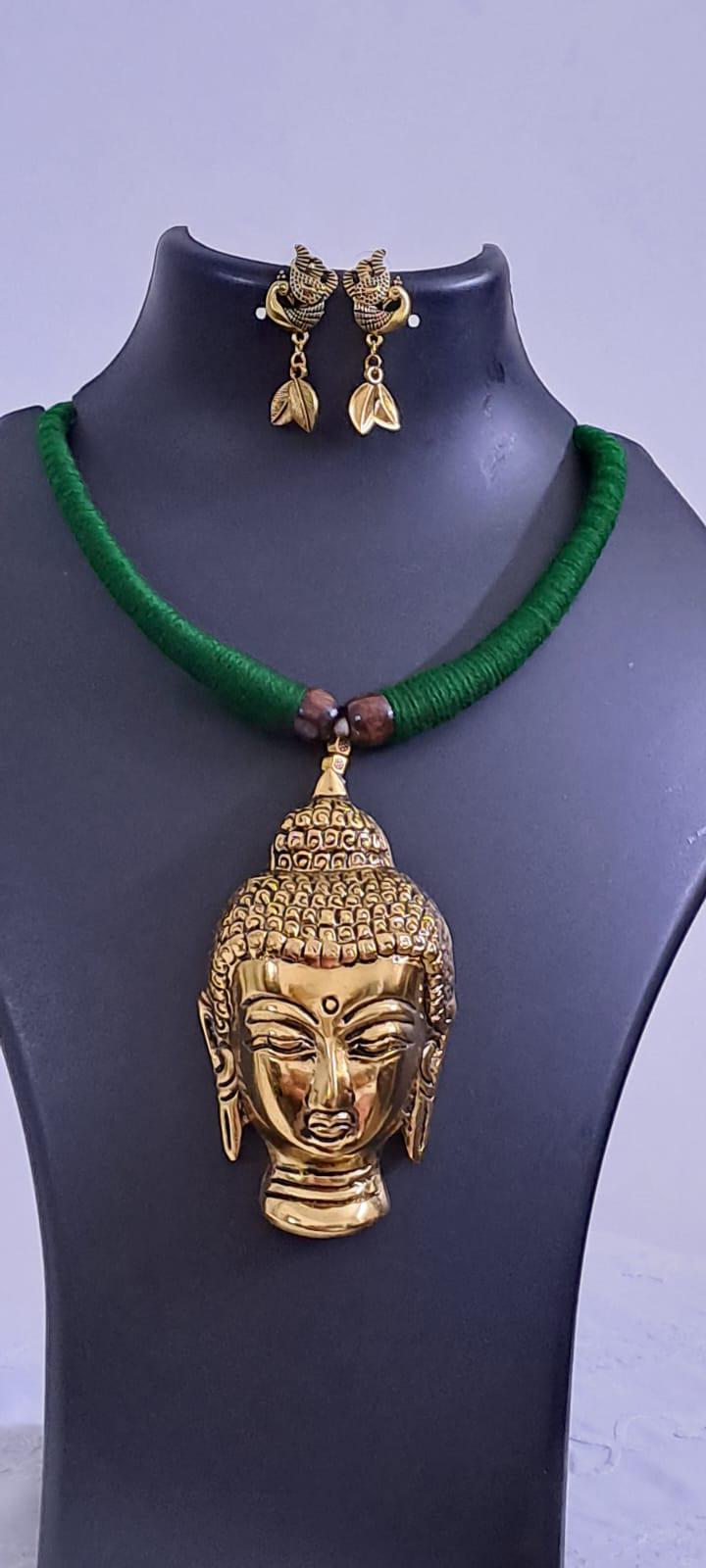 Green thread necklace with oxidised golden buddha pendant