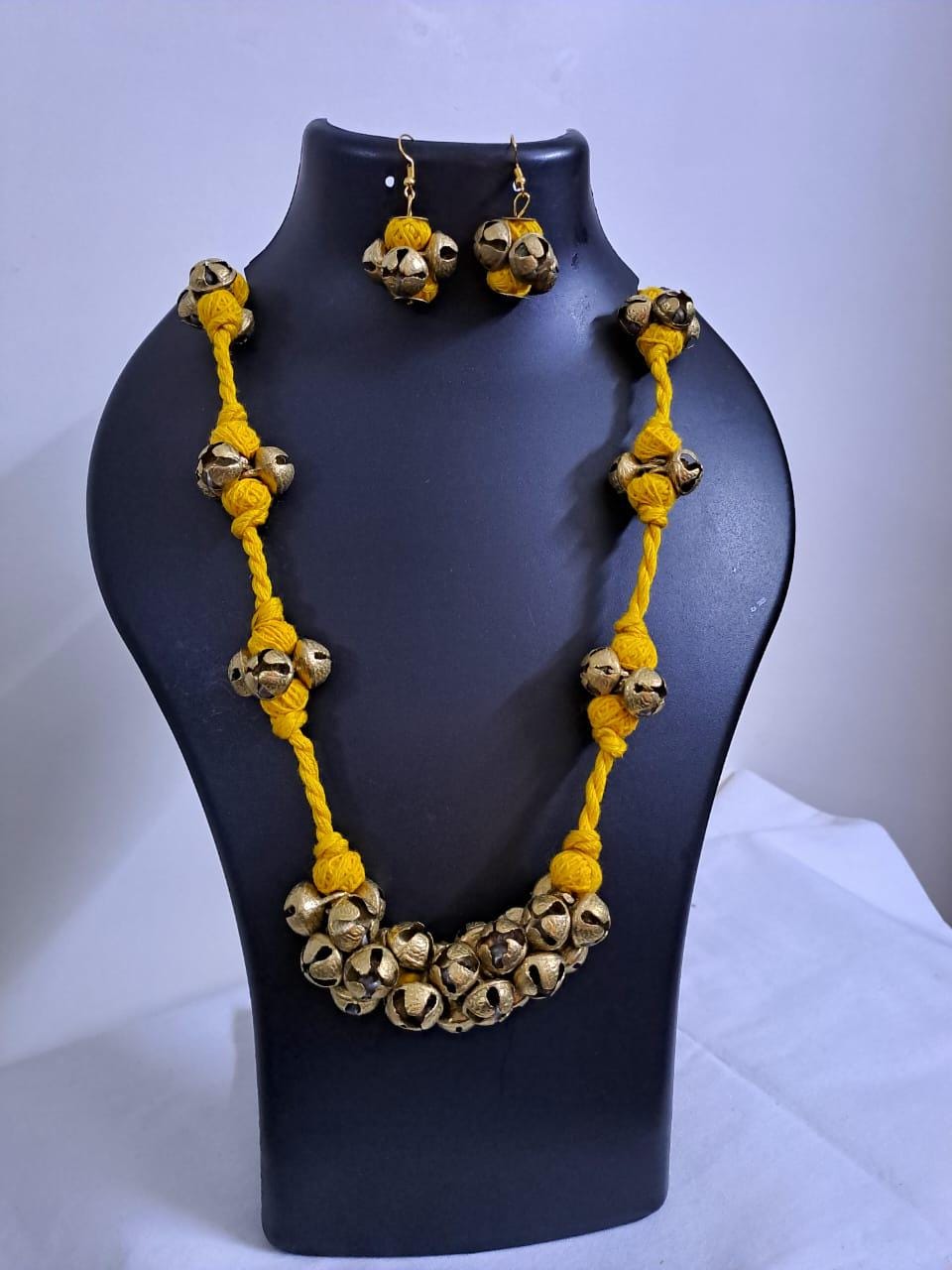 Yellow thread necklace with trinkets n matching earrings