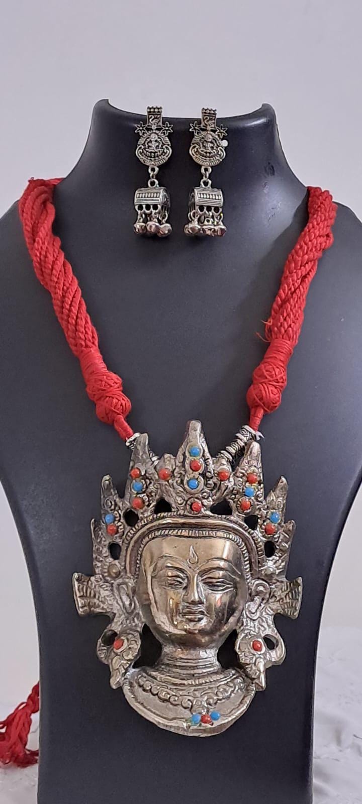 Maroon thread necklace with oxidised silver durga pendant
