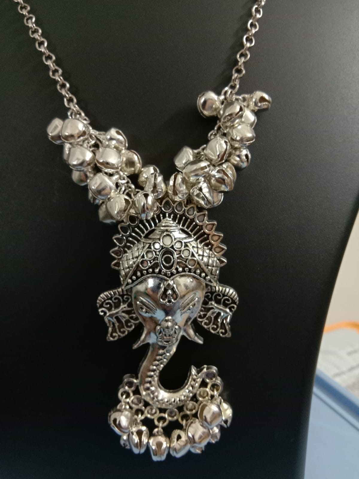 Oxidised silver chain with traditional pendant and matching earrings.