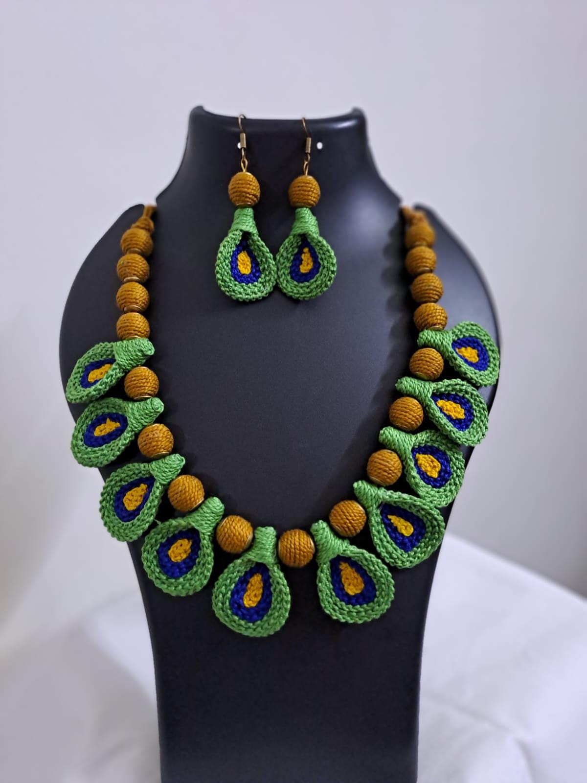 Green n yellow thread necklace with matching thread earrings.