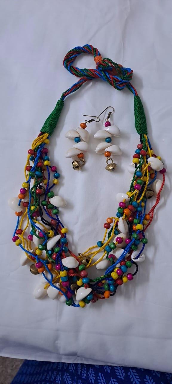 Exclusive multi-coloured and multi-layered thread necklace with shells, wooden beads n trinkets.